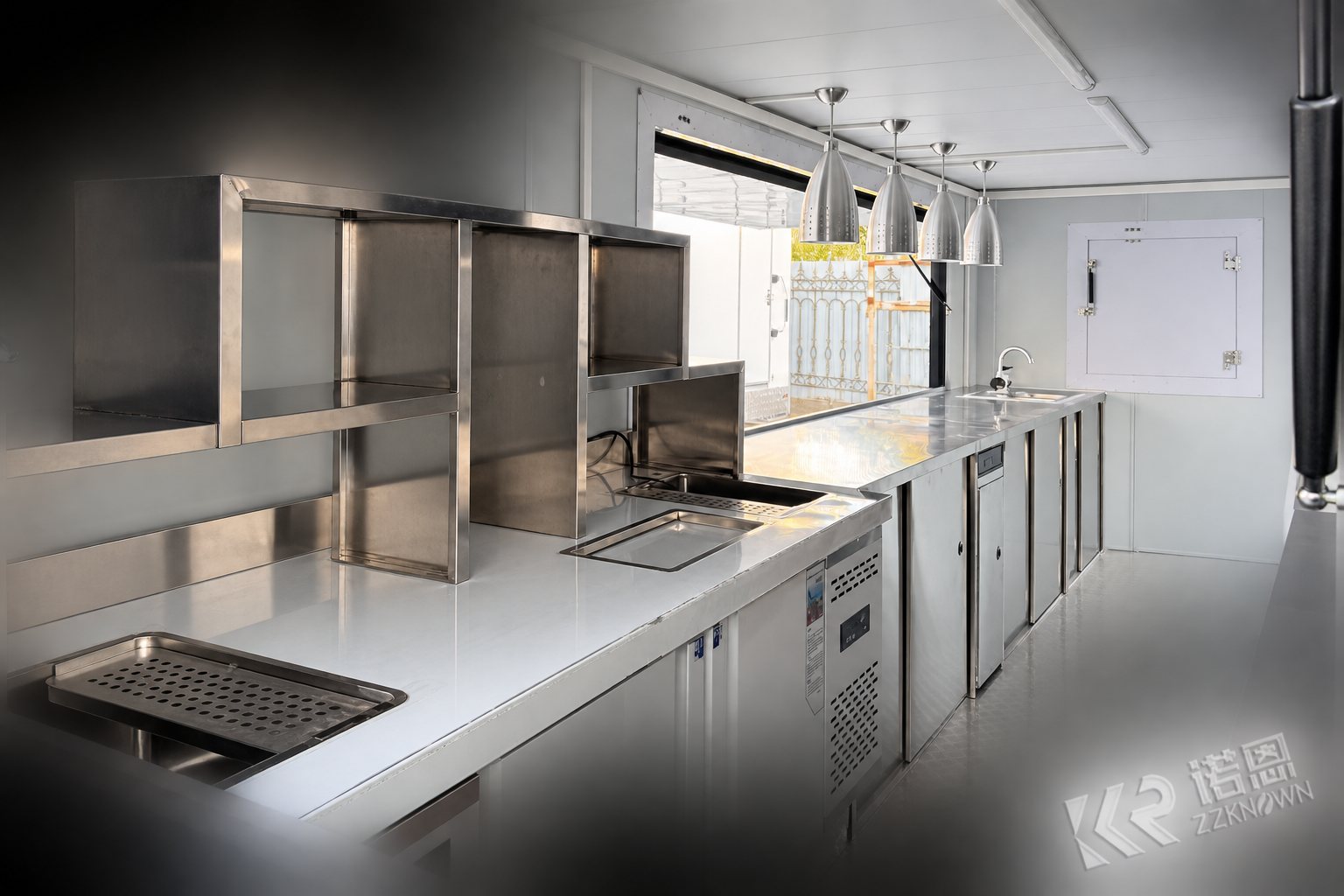Interior of the black 5.5m container restaurant project with stainless steel workbench