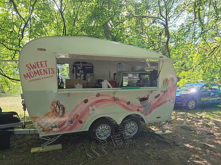 Custom curved food trailer with the serving window open