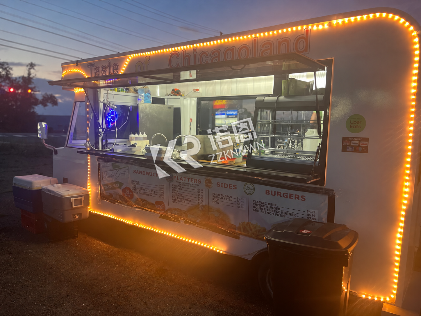 Illuminated food trailer configured for evening event service