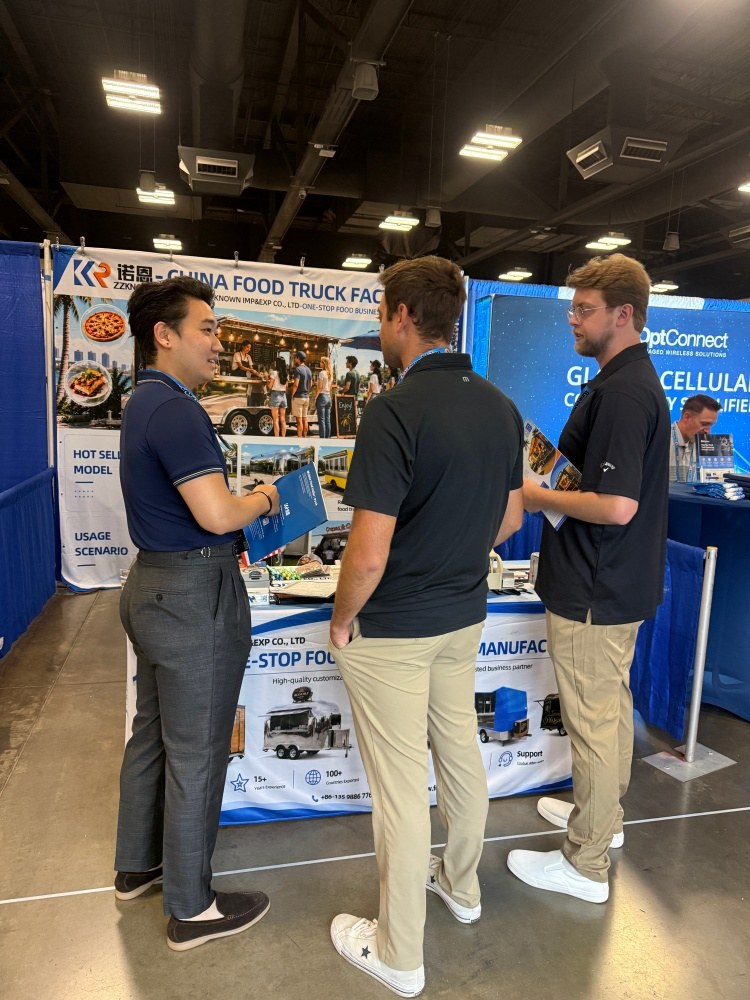 ZZKNOWN representative discussing a custom food trailer project with visitors at FTO Expo 2026
