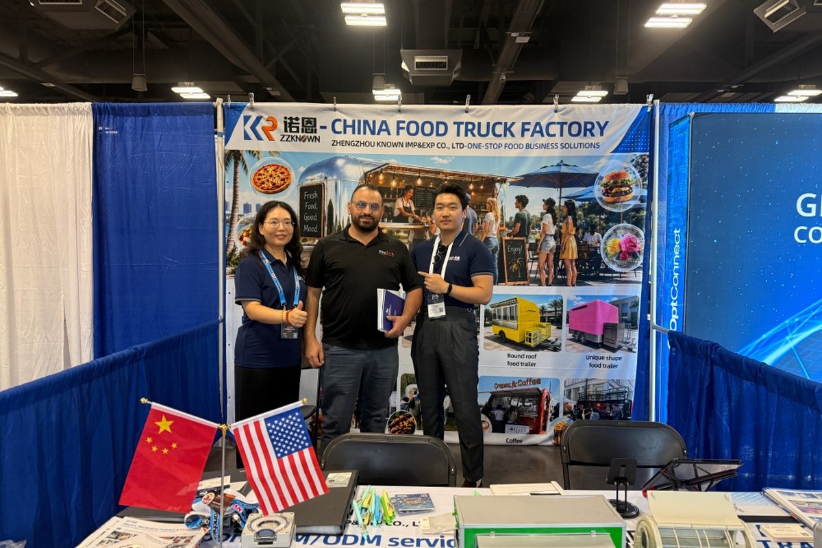 ZZKNOWN team meeting a food trailer industry visitor at Booth 215 during FTO Expo 2026 in Austin